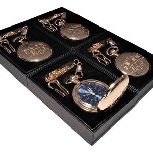 May include: Four gold pocket watches with chains in black velvet boxes. The watches have different engravings, including "Groom's Ale" and "J & E Groom".
