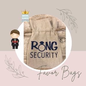 May include: A burlap favor bag with the text "Ring Security" in blue glitter lettering and a ring icon. The bag is tied with a string and has a ring on the table next to it.
