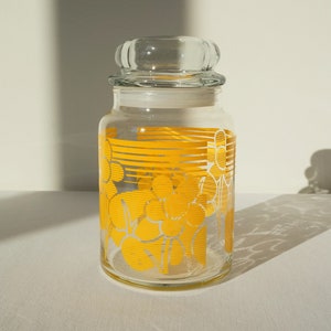 vintage clear jar with yellow floral pattern