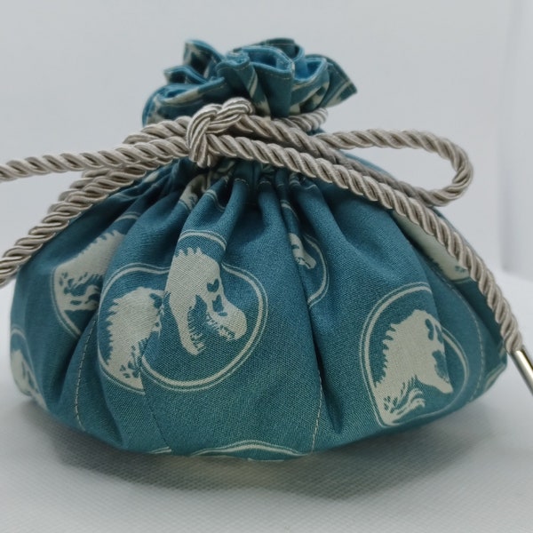 Jurassic park turquoise dice bag large holds 12 or more sets  Dice gremlin gift. Dungeons and Dragons  DnD  TTRPG dinosaurs green teal  170