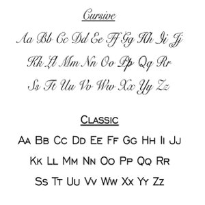 May include: A white background displays two alphabet font styles: "Cursive" and "Classic." The cursive font is a flowing script, while the classic font is a simple sans-serif style. Both fonts show the letters of the alphabet.