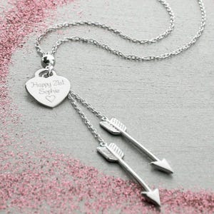 May include: Silver necklace with a heart pendant that says "Happy 21st Sophie" and two dangling arrow charms.