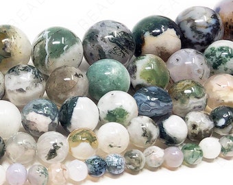 May include: A collection of round, green, white, and gray agate beads. The beads are smooth and polished, with a variety of patterns and textures.