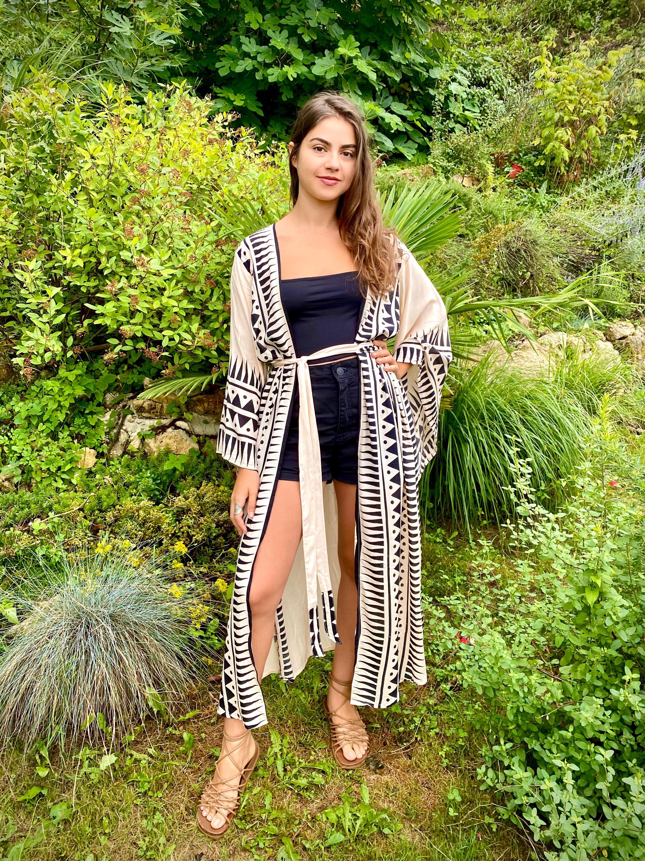 long kimono with wide sleeves. Beige dress with ethnic print