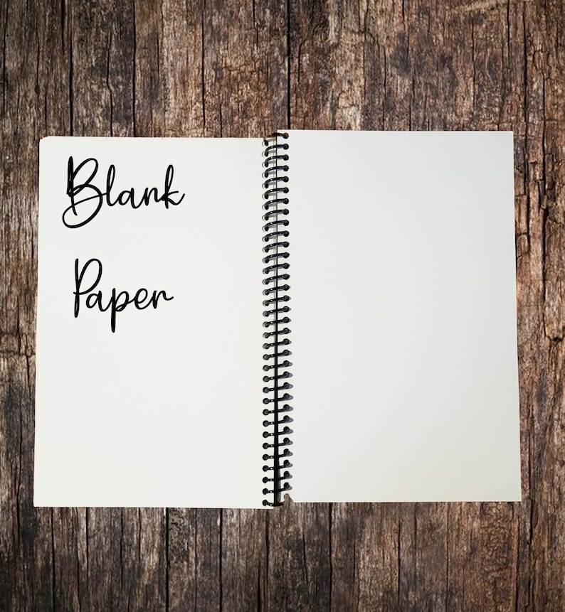 May include: An open spiral bound notebook with blank white paper. The words "Blank Paper" are written on the left page.