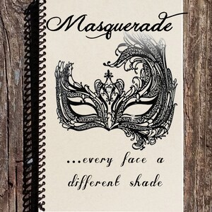 May include: A spiral bound notebook with a black and white illustration of a masquerade mask. The text "Masquerade... every face a different shade" is printed on the cover.