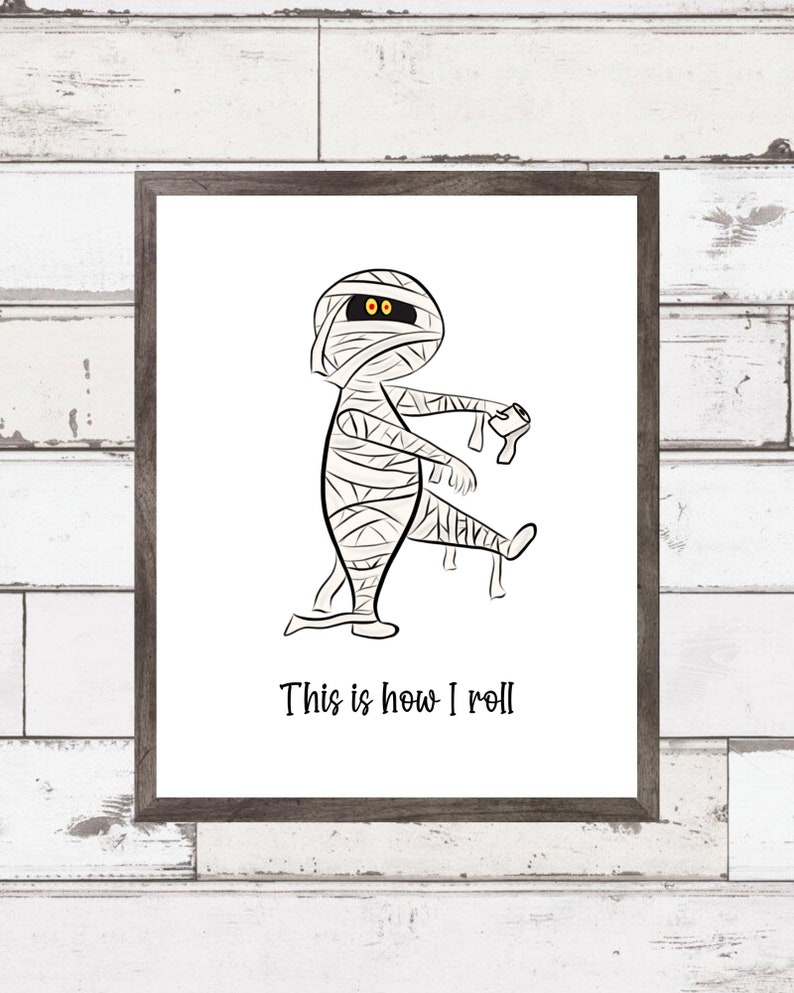 May include: A black and white illustration of a mummy with the text "This is how I roll".