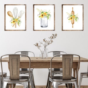 May include: Three framed watercolor prints with a farmhouse theme. The prints feature a rolling pin, kitchen utensils, and a mason jar with sunflowers.