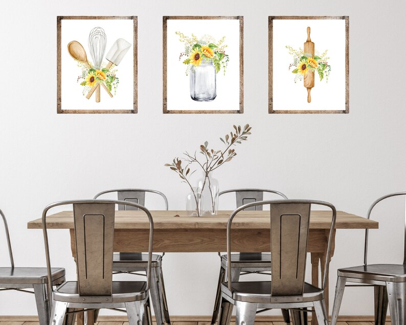 May include: Three framed watercolor prints with a farmhouse theme. The prints feature a rolling pin, kitchen utensils, and a mason jar with sunflowers.