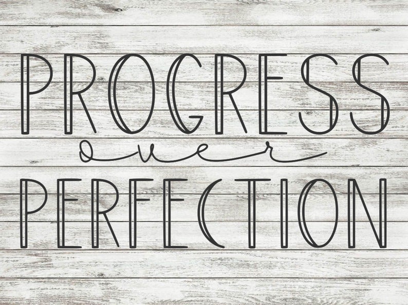 May include: Black and white text on a woodgrain background that reads "PROGRESS over PERFECTION".