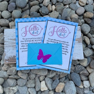 May include: Two cards with the text "Hello dot" and a blue envelope with a purple glitter butterfly. The cards have a blue polka dot border and text that reads "NO BOYS ARE ALLOWED". The envelope is centered.