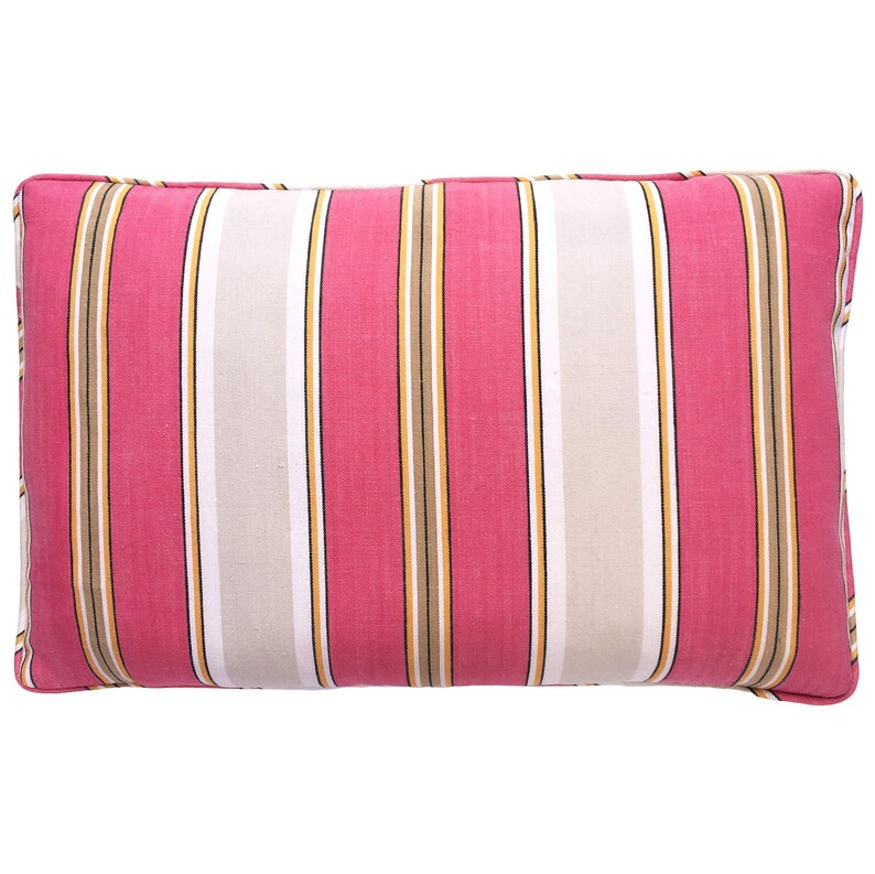 May include: A pink and white striped throw pillow with brown and yellow stripes. The pillow is rectangular and has a soft, plush texture.