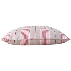 May include: A rectangular grey and pink striped cushion with red stripes. The cushion is made of a soft, woven fabric.