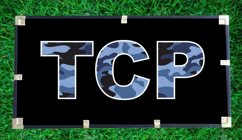 May include: A black banner with the word "TCP" in white letters. The letters are filled with a blue and black camouflage pattern.
