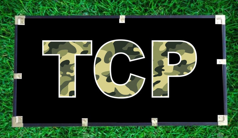 May include: A black banner with the word "TCP" in white letters. The letters are filled with a camouflage pattern in shades of green and tan.
