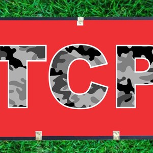 May include: A red banner with the word "TCP" in white letters with a camouflage pattern.