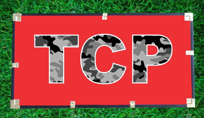 May include: A red banner with the word "TCP" in white letters with a camouflage pattern.