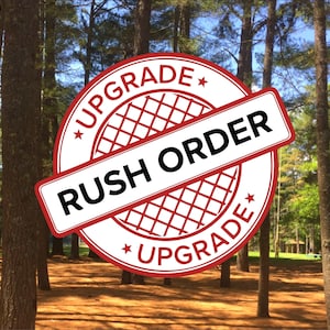 May include: A red and white circular stamp with the text "*UPGRADE* RUSH ORDER *UPGRADE*" in a forest setting.