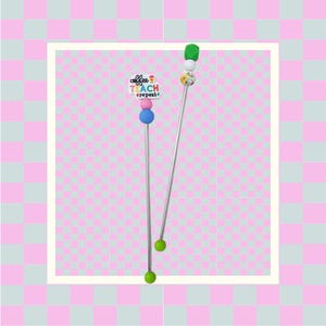 May include: Two silver stirring sticks with colorful beads and a charm that says "coffee teach repeat".