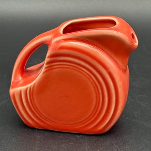 Fiesta ware retired persimmon Orange mini disk pitcher or creamer Fiestaware miniature