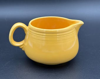 Vintage Fiesta individual yellow creamer from promotional campaign cream and sugar figure 8 tray set Fiestaware 1940s