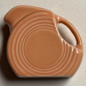 Fiesta Ware retired Apricot Peach mini disk pitcher or creamer Fiestaware miniature disc POST 1986