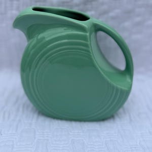 Fiestaware small disk juice 5&quot; pitcher Fiesta retired Sea Mist Seamist green 28 ounces Post 1986
