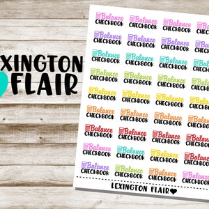 May include: A sheet of colorful stickers with the text "Balance Checkbook" repeated multiple times. The stickers are in various colors, including pink, yellow, orange, green, and blue. The text "LEXINGTON FLAIR" appears at the top and bottom of the sheet.