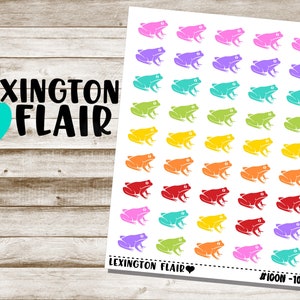 May include: A sheet of colorful frog stickers with the text "Lexington Flair" and "#ICON-102" at the bottom. The frogs are in a rainbow of colors, including pink, purple, blue, green, yellow, orange, and red.