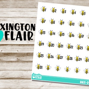May include: A sheet of 31 bee-themed stickers with numbers 1 through 31. The stickers are yellow and black with a white background. The sheet is labeled "Lexington Flair" and "DATE-22".