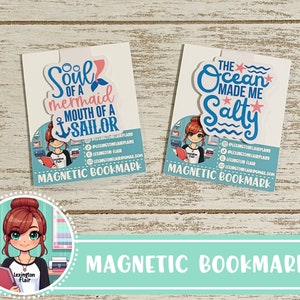 May include: Two magnetic bookmarks with a nautical theme. The first bookmark features a pink mermaid tail with the text "Soul of a mermaid mouth of a sailor". The second bookmark features a blue wave with the text "The ocean made me salty". Both bookmarks have a white background and blue accents.