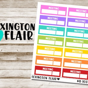 May include: A set of 10 colorful "Meeting" planner stickers with a rainbow color scheme. The stickers are rectangular and have a white border. The text "LEXINGTON FLAIR" and "#B-1001" are printed at the bottom of the sheet.