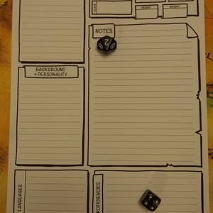May include: A white character sheet for a role-playing game, with black outlines and labeled sections for information. Two six-sided dice are on the sheet. The sheet includes sections for "Companion", "Background + Personality", "Languages", and "Proficiencies".