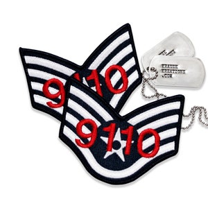 May include: Two embroidered patches with a black background, white stripes, and the red numbers "9110". A white star is in the center. Two silver dog tags with the text "KRAUSE KREATIONS .COM" are also present.