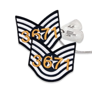 May include: Two embroidered patches with navy blue and white stripes and the number "3671" in gold. Two silver dog tags with the text "KRAUSE KREATIONS .COM" are also visible.