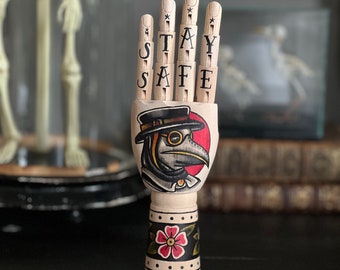 MINI wooden hand with a plague doctor and flowers tattoo design