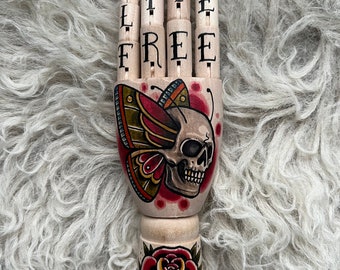 SMALL Wooden hand with a skull with butterfly wings and rose tattoo design