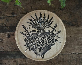 Wooden plate with an original drawing of a sacred heart