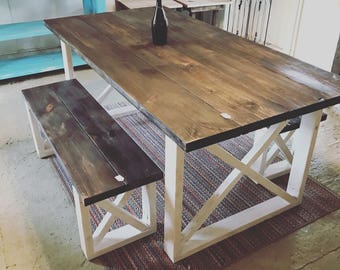 Rustic Farmhouse Table With Benches with Dark Walnut Top and Weathered White Base and Cross Brace Design.