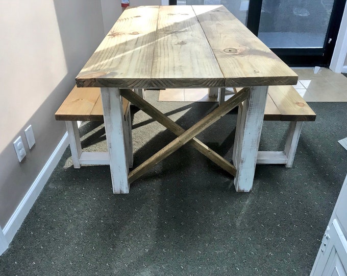 Rustic Farmhouse Table With Benches with Light Walnut Top and Weathered White Distressed Base and Cross Brace Design.