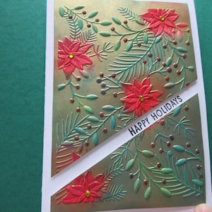 Carte de Noël, beaux poinsettias 3D sur fond doré.  « Joyeuses Fêtes ». Centres de gemme orange.