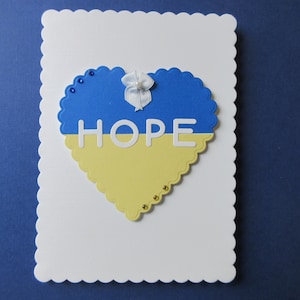 Hope for the Ukraine, heart with Ukraine colors, blue and yellow, &quot;Hope&quot;  with thoughts and prayers.