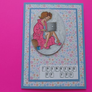 Thinking of you card, lady on her couch, lap top, working at home, missing her friends and co-workers