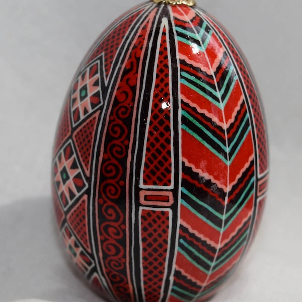 Pysanky on duck egg.  One of a kind.  Red, green, orange and white on a black background.  Traditional Pysanky Ukrainian Egg Pisanka