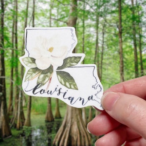 Adesivo impermeabile in vinile opaco con contorno dello stato della Louisiana e fiore di magnolia