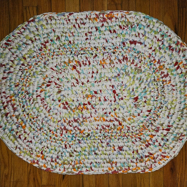 Handmade crocheted rag rug in colorful white, red, orange, lime and andliggt teal 34"x26"