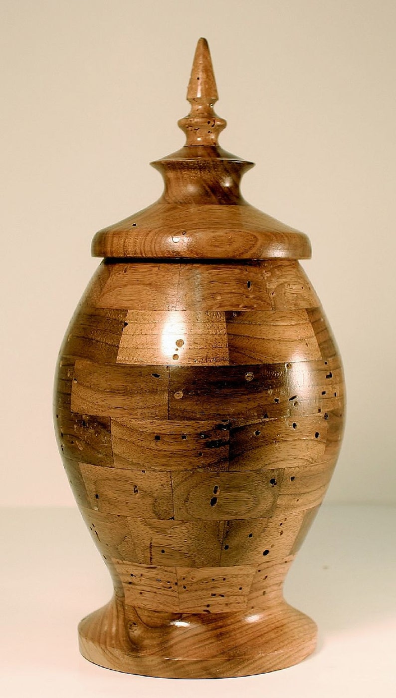 This Wooden Hand Crafted Segmented Urn is Made With Wormy Butternut It