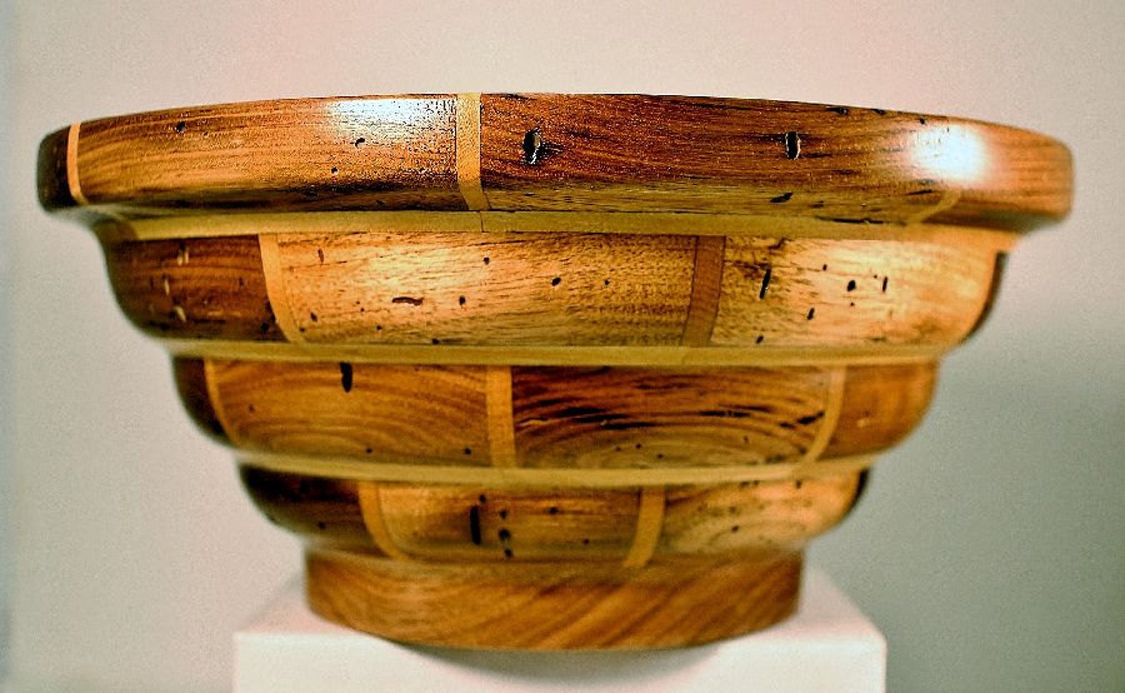 This Segmented Hand Crafted Wooden Bowl is Made of Wormy Butter Nut