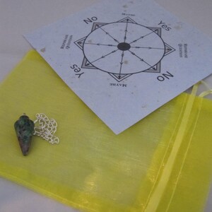 May include: A rustic wooden sign with the text "Welcome to our home" in a handwritten style. The sign is painted white with a distressed finish, and features a decorative floral element.