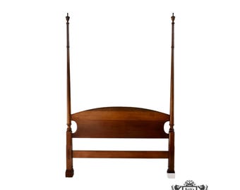 May include: A dark wood poster bed frame with tall posts and a curved headboard.